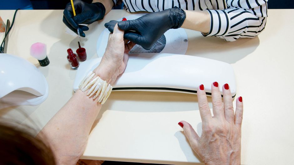 Applying a protective top coat for long-lasting nail polish