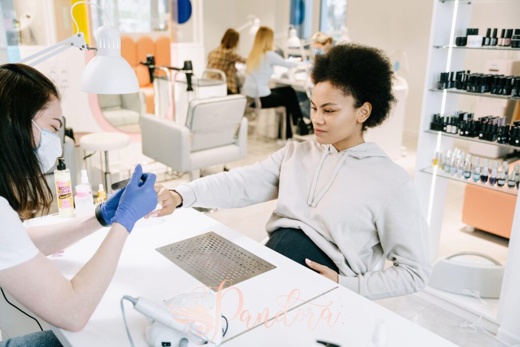Client receiving manicure after eating healthy foods at Pandora Nail Spa in Lafayette