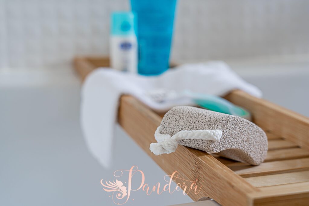 Applying foot care tips: soaking feet during a pedicure at Pandora Nail Spa.
