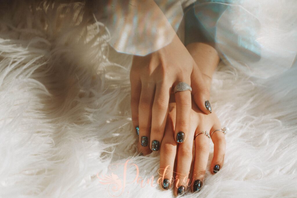 Elegant prom nails with glitter and rhinestones at Pandora Nail Spa in Lafayette