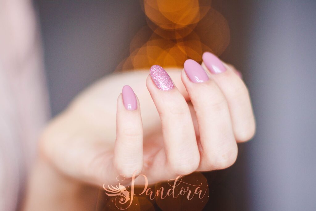 Builder gel for nails being applied at a salon in Lafayette