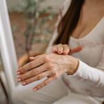 Close-up of a woman moisturizing her hands, focusing on self-care and beauty — Pandora Nail Spa, Lafayette, CA
