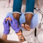 Professional foot massage during a pedicure at a Lafayette nail salon
