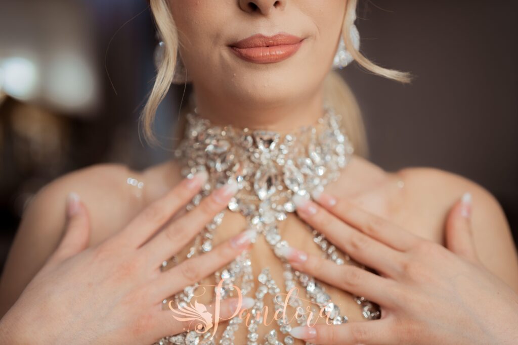 Elegant close-up of a woman wearing intricate sparkling jewelry, showcasing style and luxury — Pandora Nail Spa, Lafayette, CA