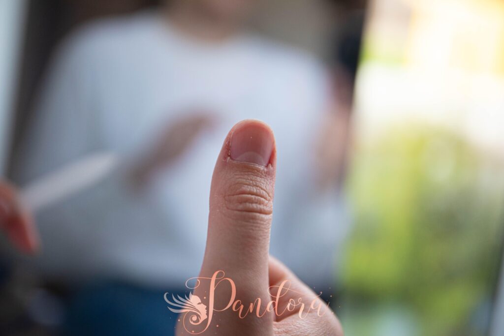 Detailed view of a thumb with a blurred background, showcasing texture and focus — Pandora Nail Spa, Lafayette, CA