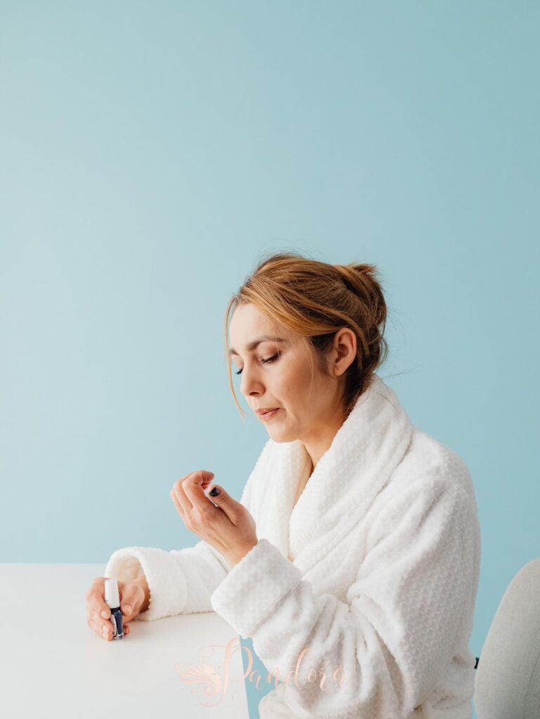 Sleep and brittle nails concept illustrated with a woman receiving nail care at Pandora Nail Spa in Lafayette, CA.