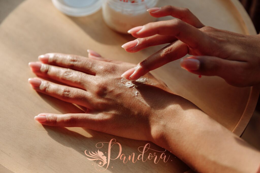 Hands applying moisturizing cream for healthy skin care treatment — Pandora Nail Spa, Lafayette, CA