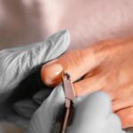 Close-up of a professional pedicure treatment using cuticle tongs — Pandora Nail Spa, Lafayette, CA